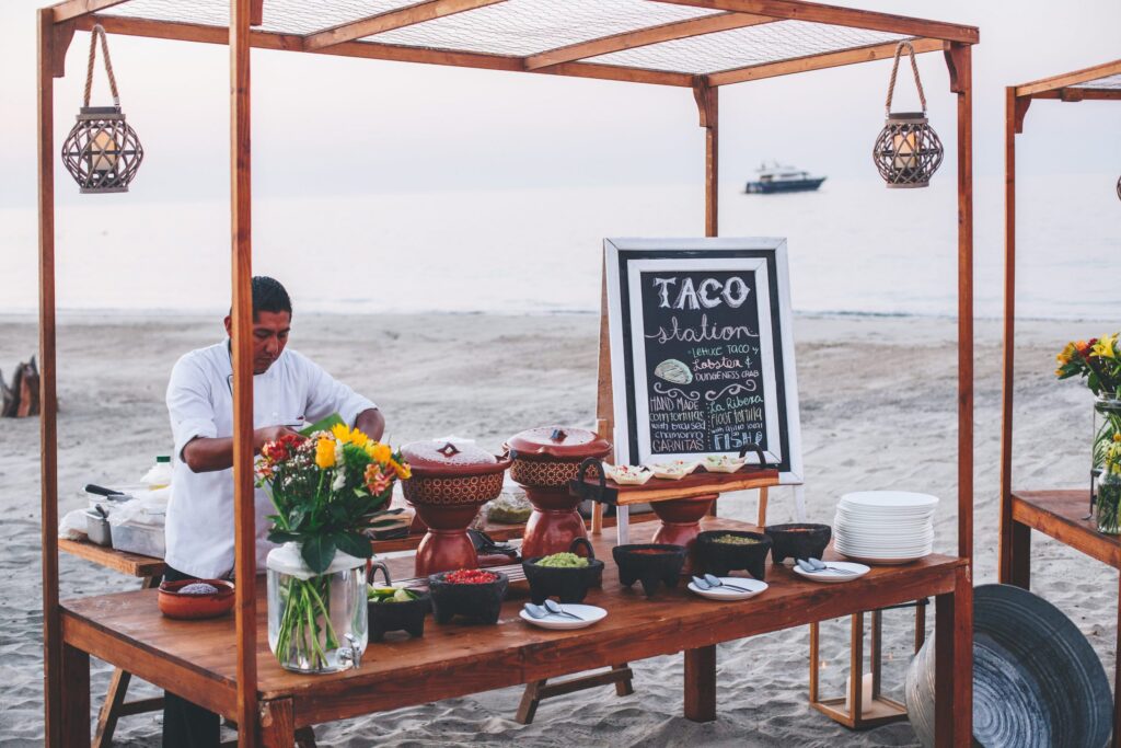 A taco station on the beach at Costa Palmas features fresh tortillas, lobster, carnitas and fish