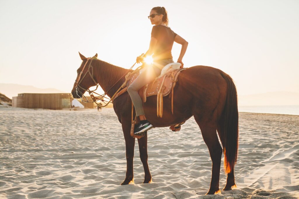 A women enjoying nature on horseback in East Cape Baja, Mexico